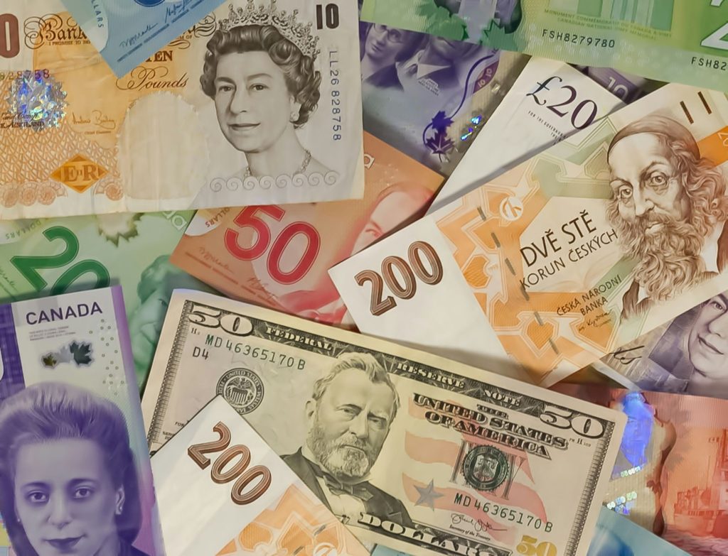 Banknotes from several countries overlapping — the economics of biological security.
